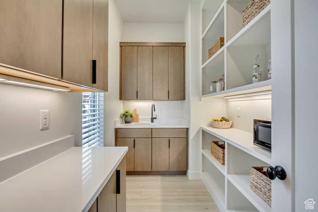 Storage area featuring a sink