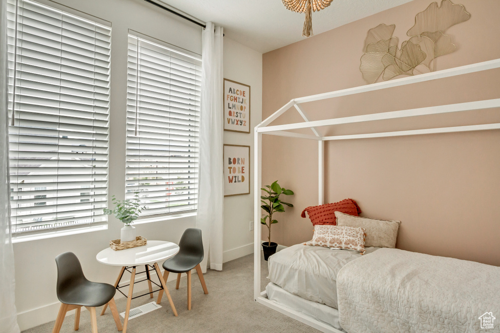 Carpeted bedroom featuring baseboards