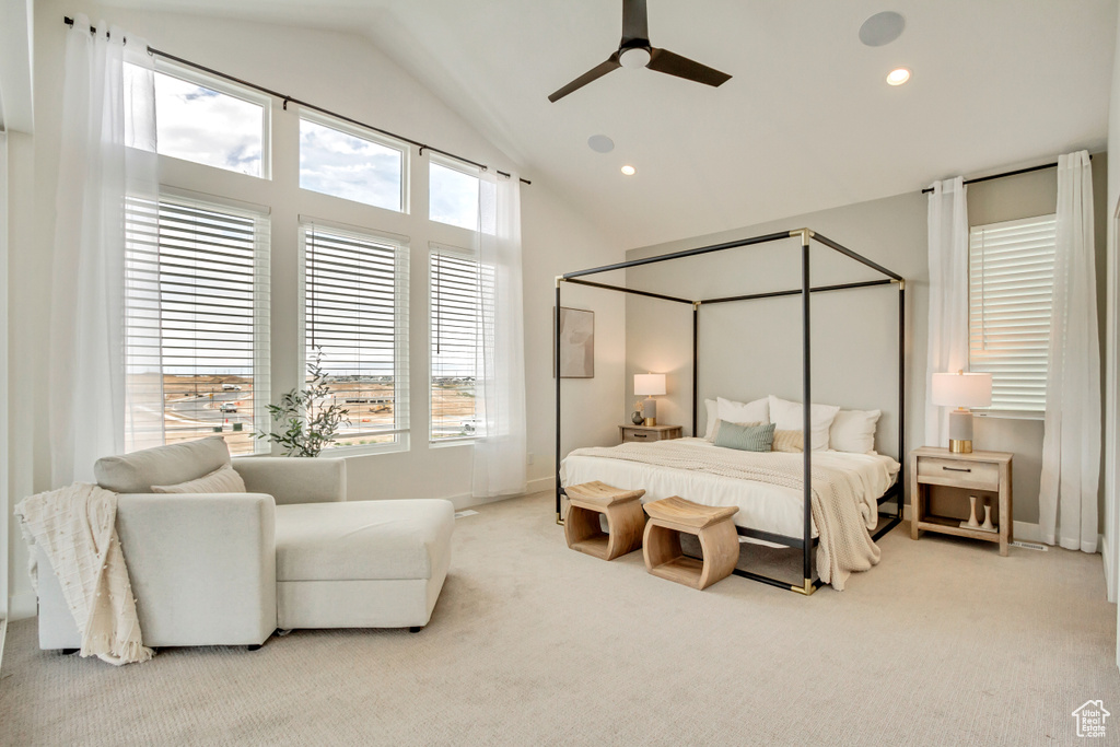 Bedroom with carpet, recessed lighting, ceiling fan, baseboards, and high vaulted ceiling