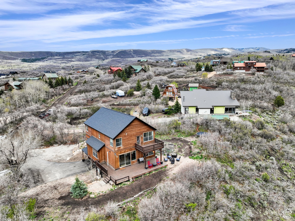 View of subject property with a mountain backdrop