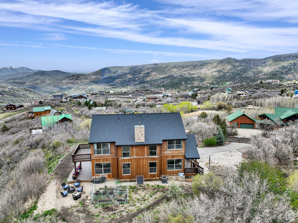 View of subject property with a mountainous background