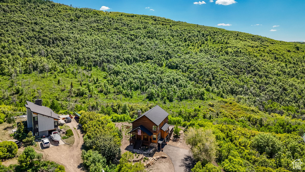 View from above of property with a forest