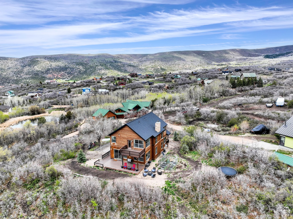 View from above of property with a mountain backdrop