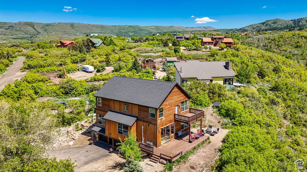 View of subject property featuring mountains