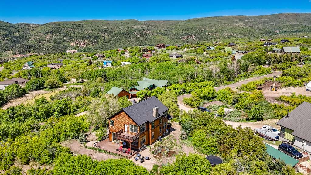 Aerial view of residential area featuring a mountainous background