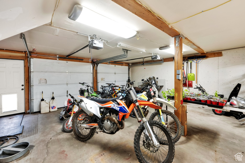 Garage featuring a garage door opener