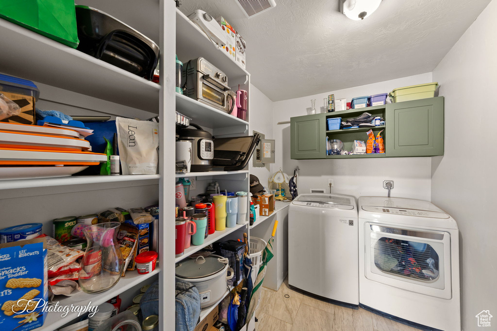 Washroom featuring independent washer and dryer