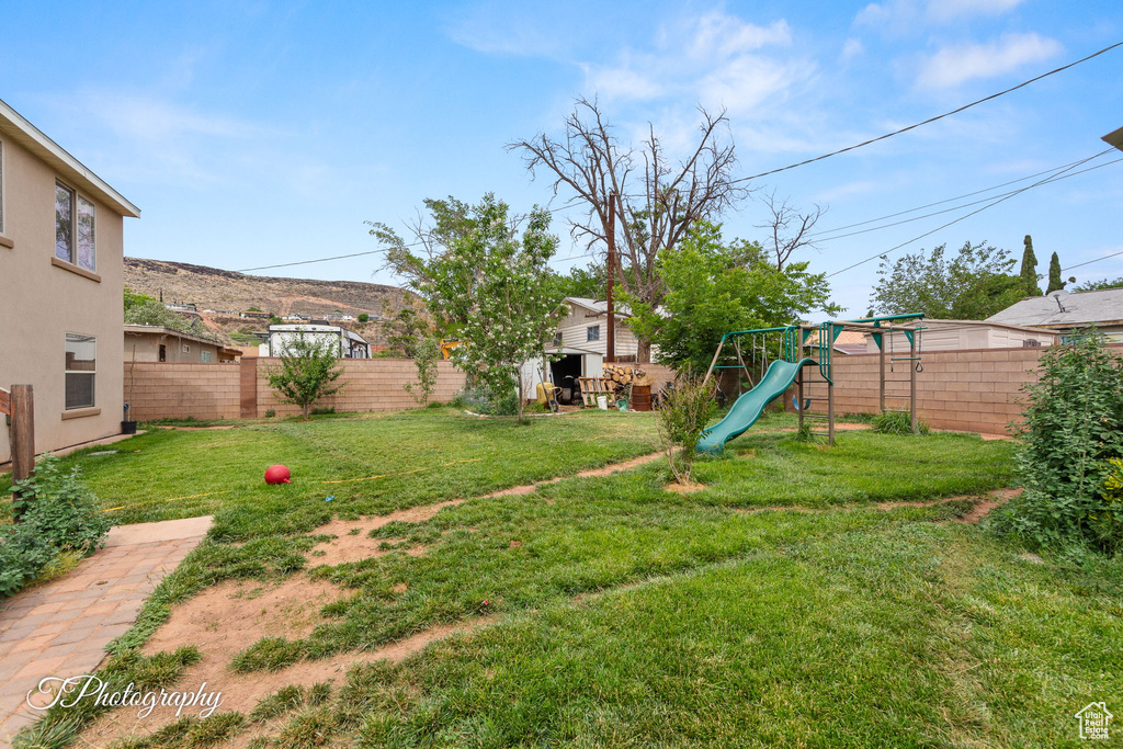 View of yard featuring a playground