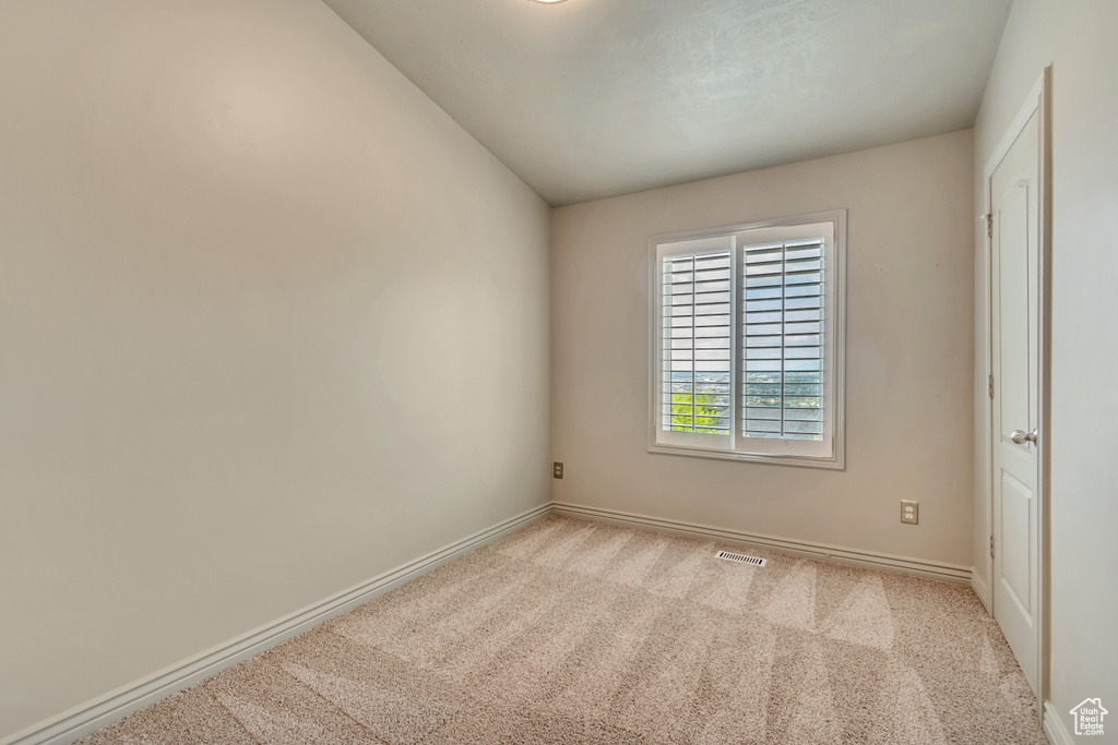 Spare room with carpet flooring and baseboards