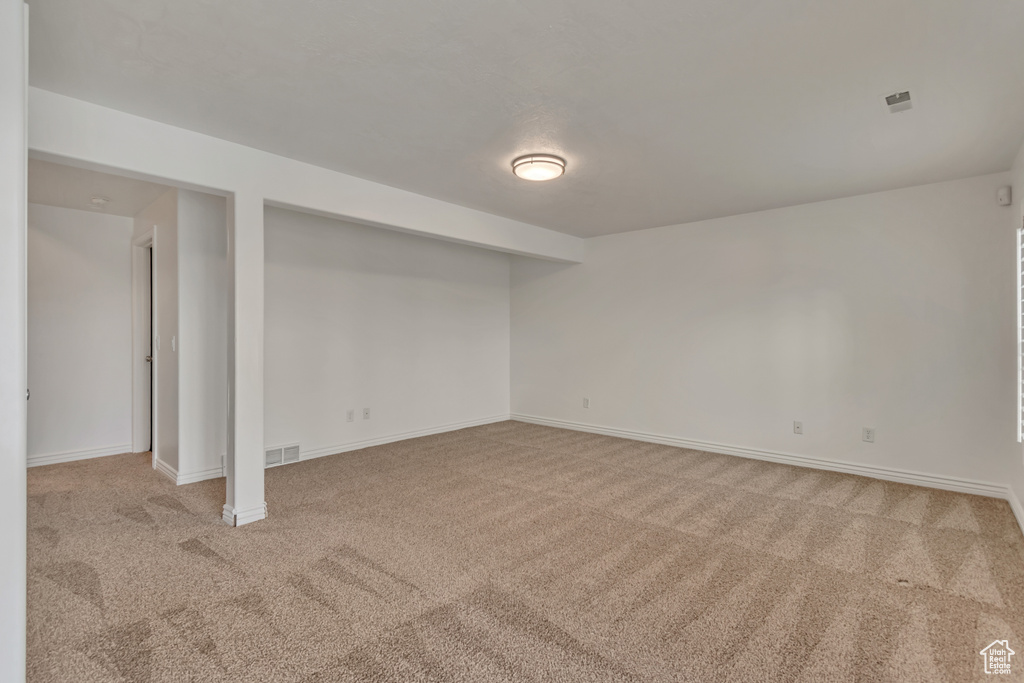 Below grade area with carpet floors and baseboards