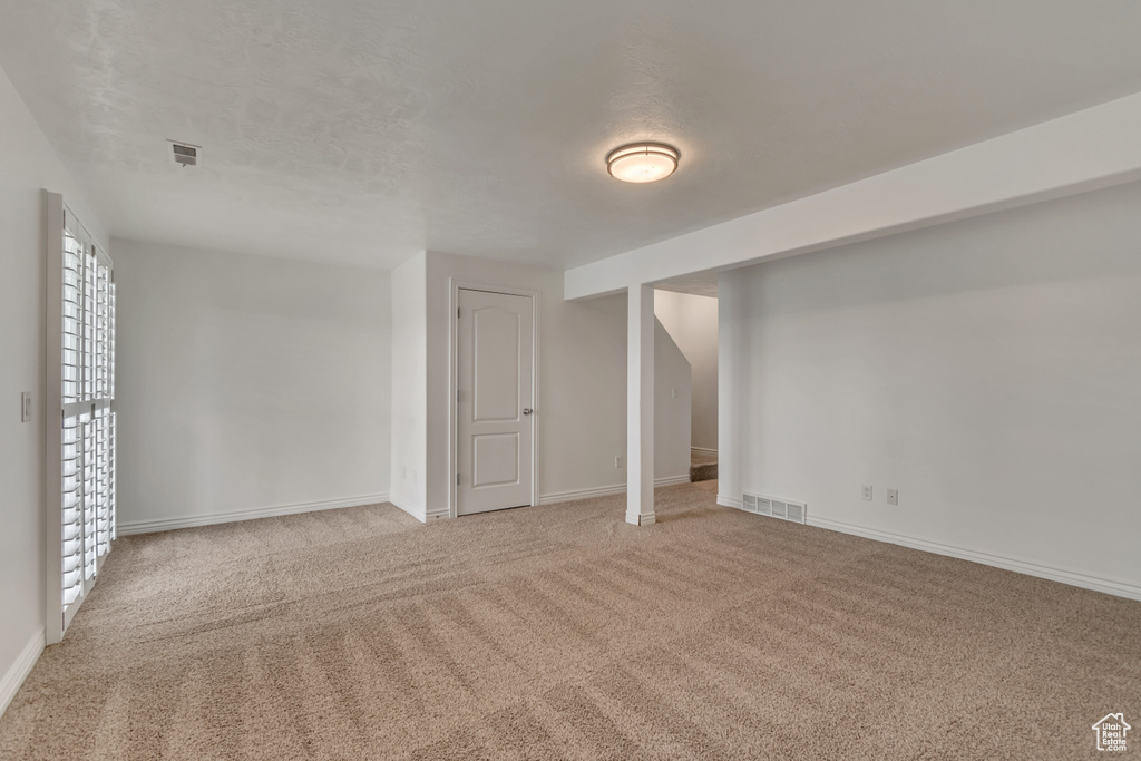 Basement with carpet and baseboards