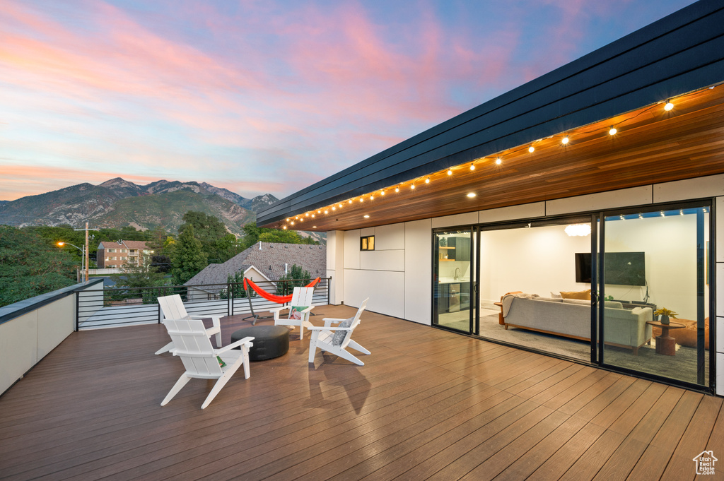 Wooden terrace with a mountain view and a fire pit