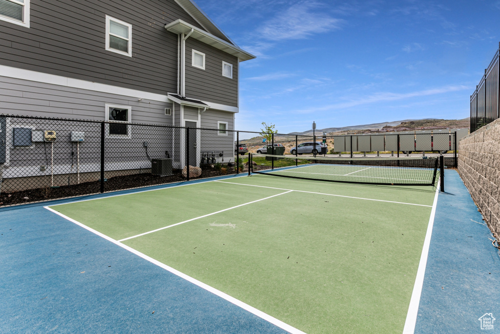 View of tennis court with fence