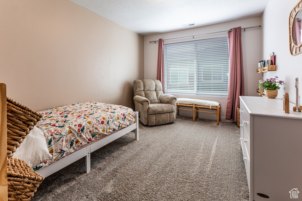 Bedroom with light carpet