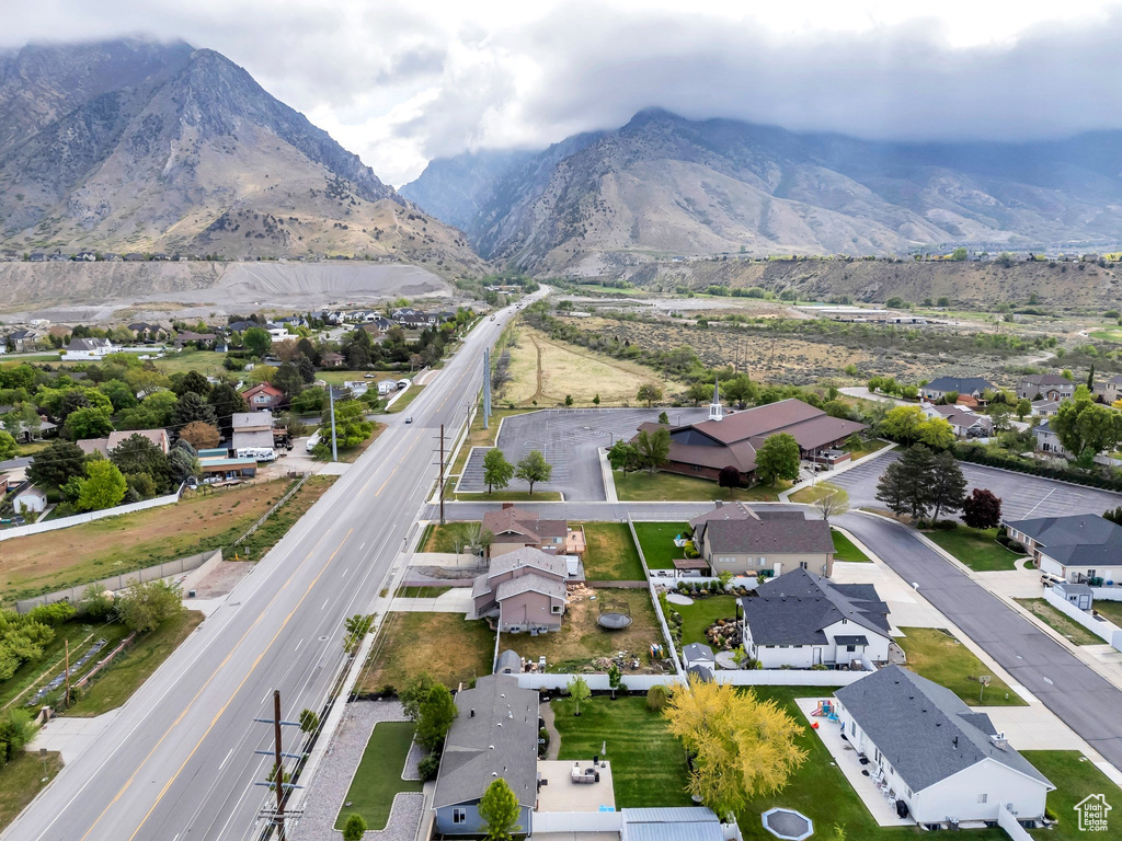 Aerial view of residential area featuring a mountain backdrop