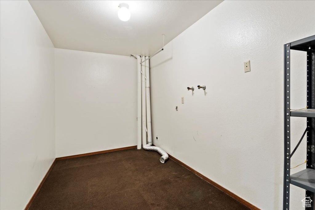 Carpeted spare room with baseboards