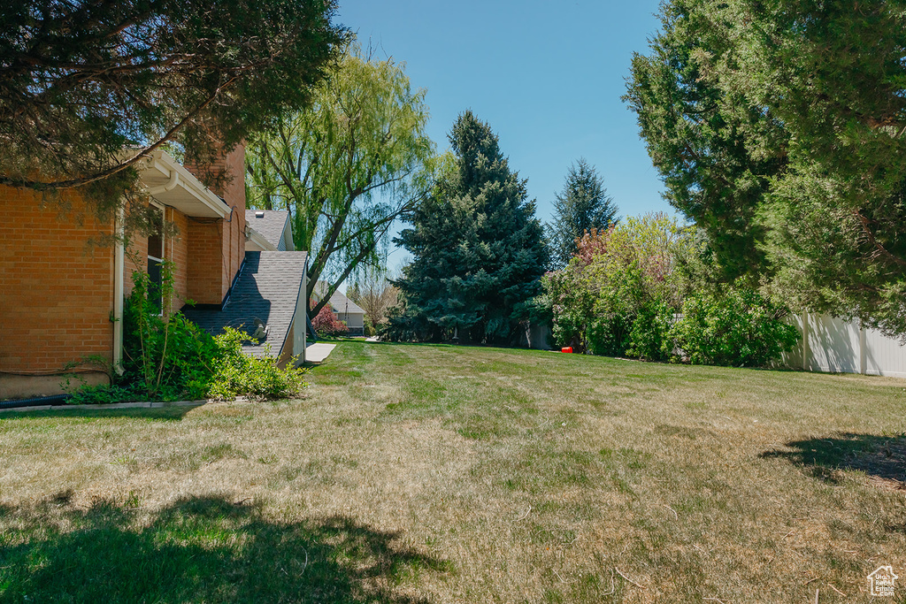 View of yard with fence