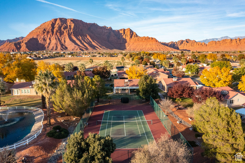 Aerial perspective of suburban area with a mountainous background