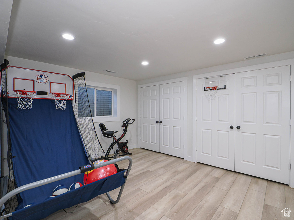 Rec room featuring light wood-style flooring and recessed lighting