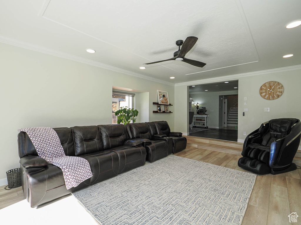 Living area featuring light wood-type flooring, ornamental molding, ceiling fan, and recessed lighting