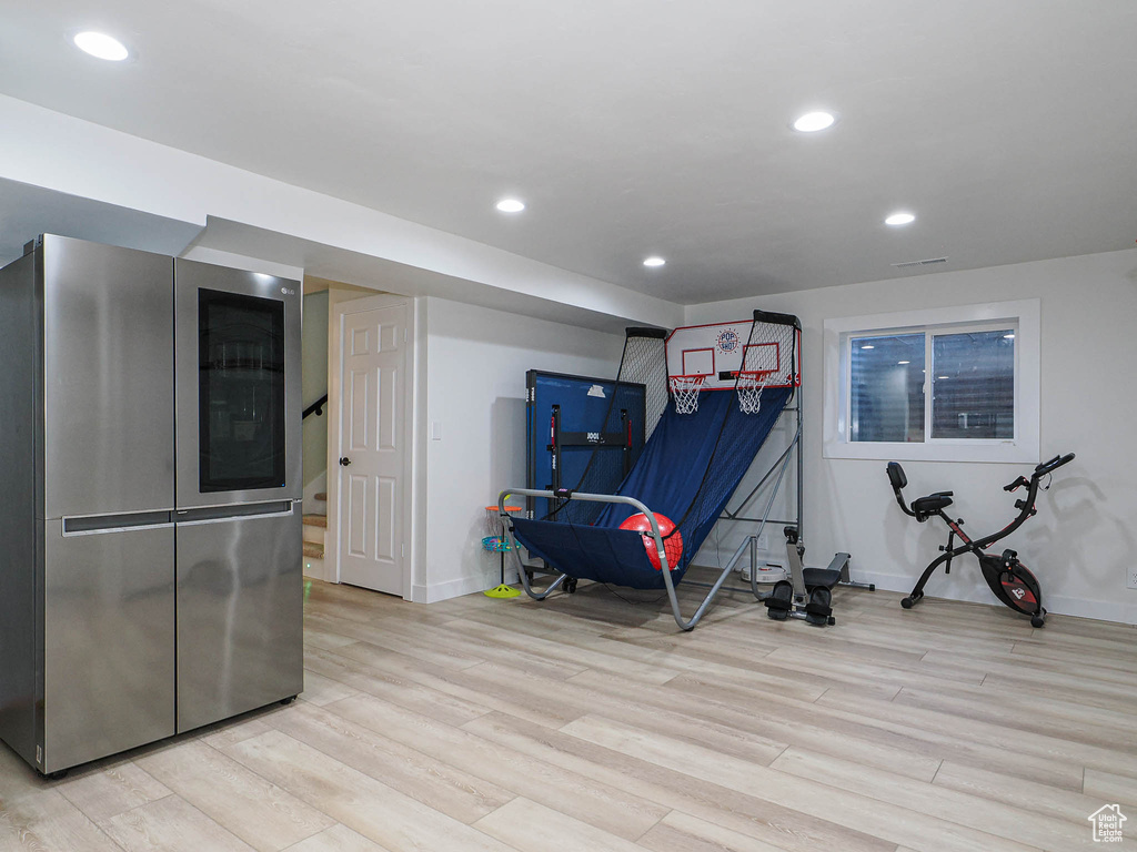 Game room featuring light wood-style floors, baseboards, and recessed lighting