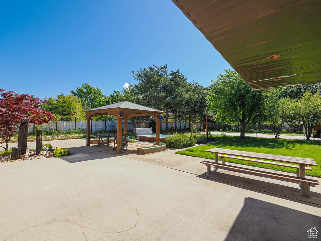 View of property's community featuring a gazebo and a patio
