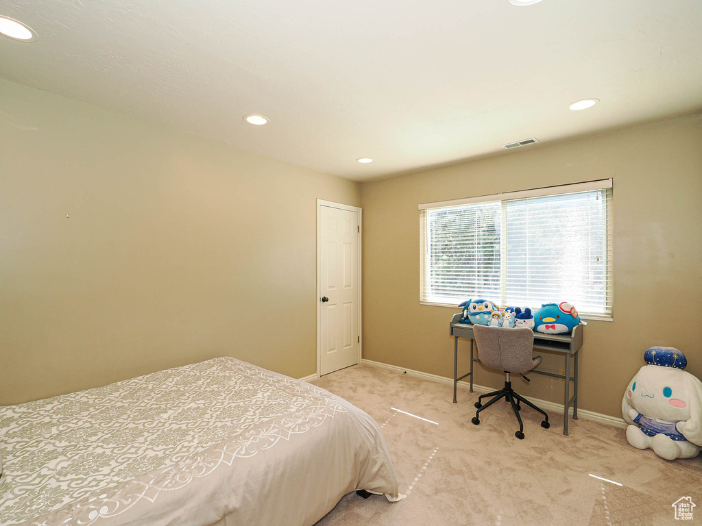 Bedroom featuring carpet flooring, baseboards, and recessed lighting