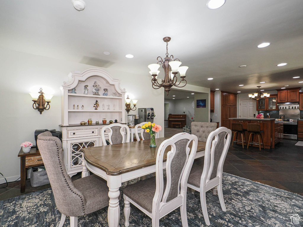 Dining area featuring a chandelier and recessed lighting