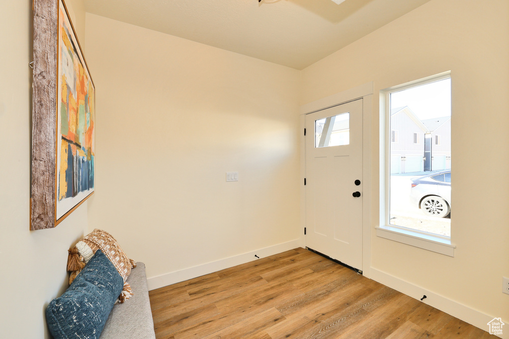 Foyer featuring baseboards and light wood finished floors