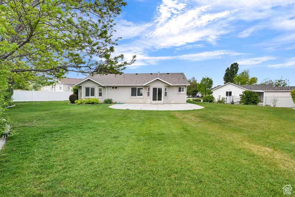 Back of house featuring a patio and stucco siding