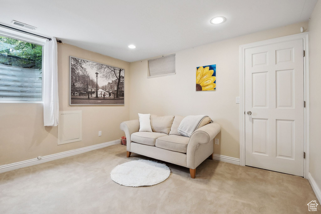 Sitting room with carpet flooring, baseboards, and recessed lighting