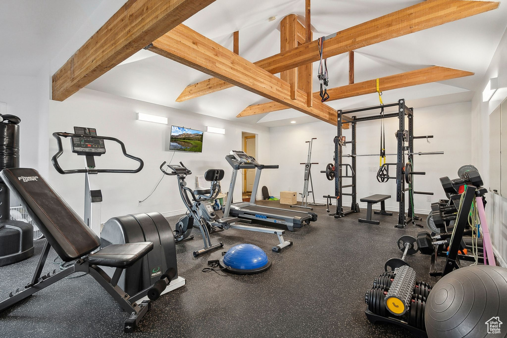 Gym with beamed ceiling