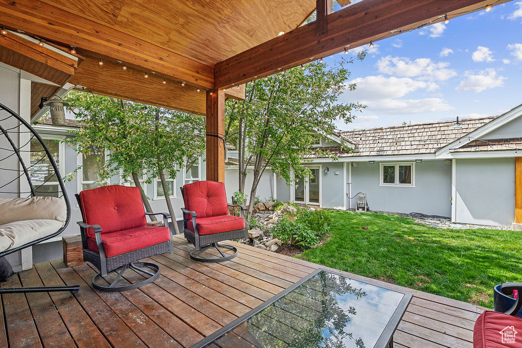 Wooden terrace with a lawn