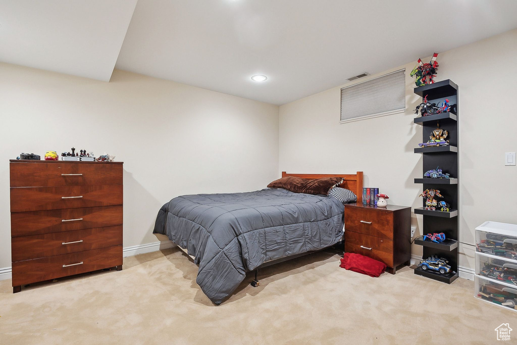 Carpeted bedroom with baseboards and recessed lighting