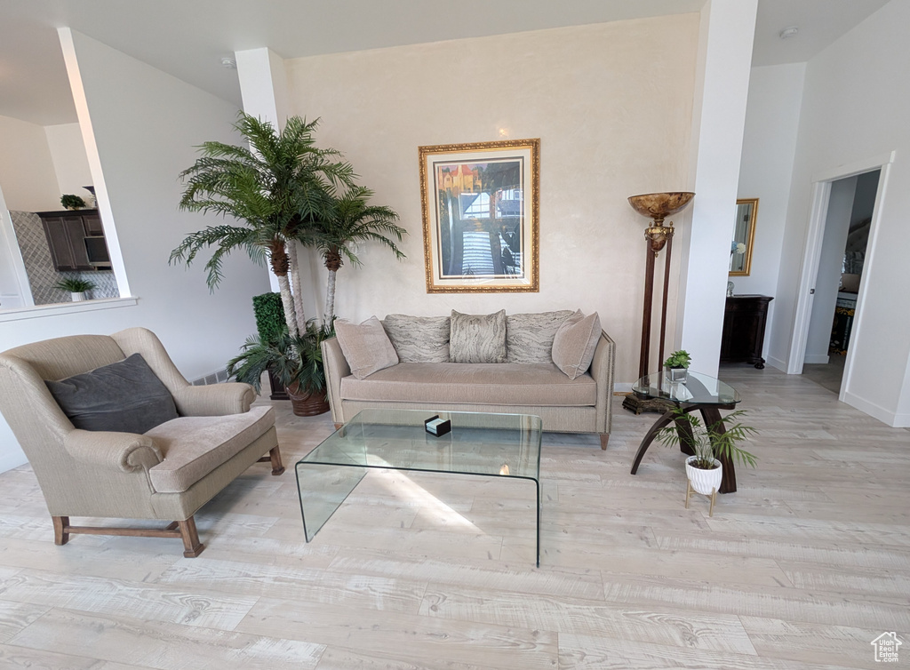 Living room featuring baseboards and wood finished floors
