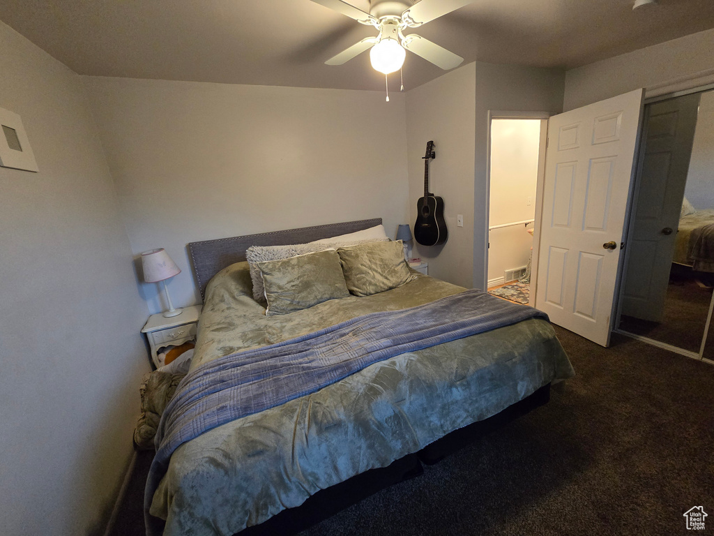 Bedroom with carpet flooring and a ceiling fan