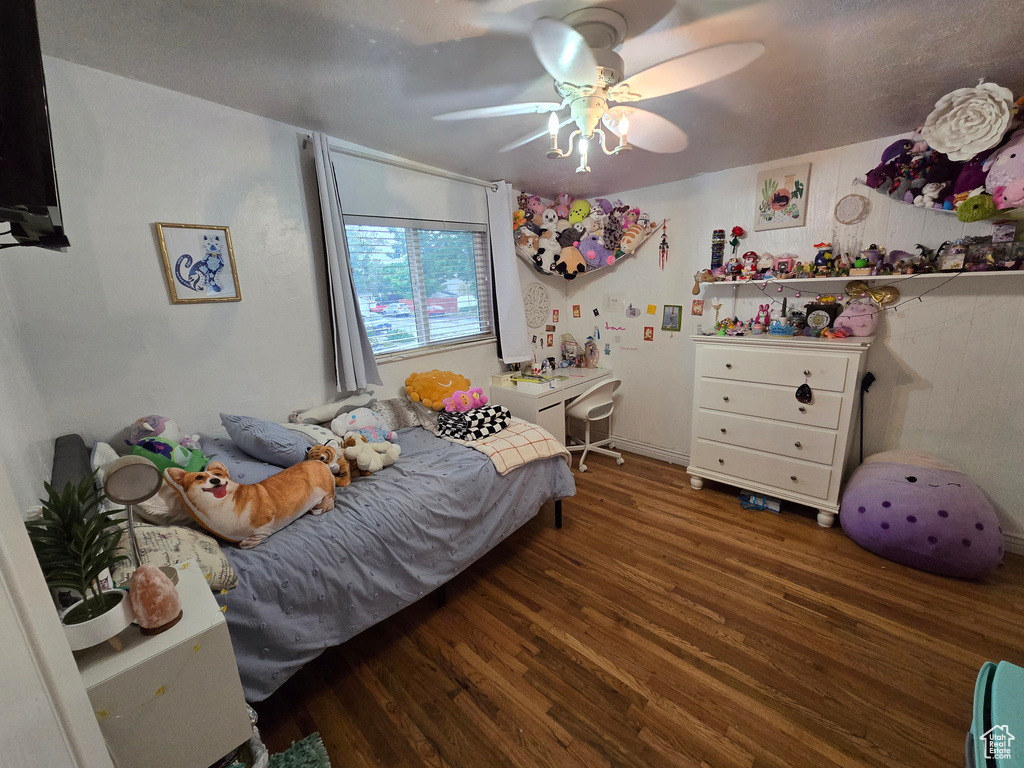 Bedroom with wood finished floors and ceiling fan