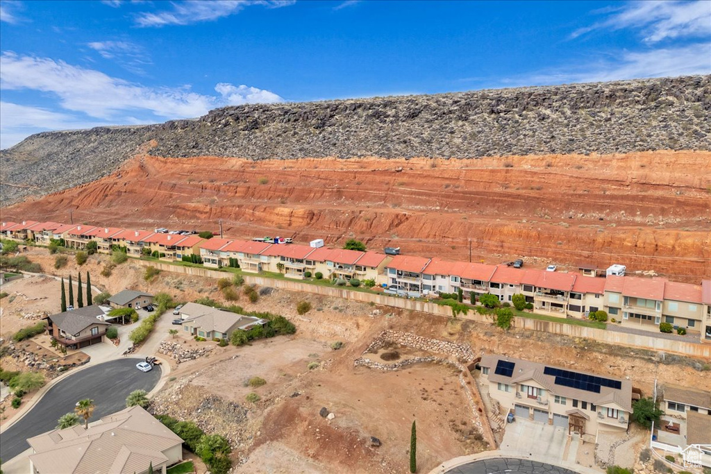 View of property location with a mountain backdrop and nearby suburban area