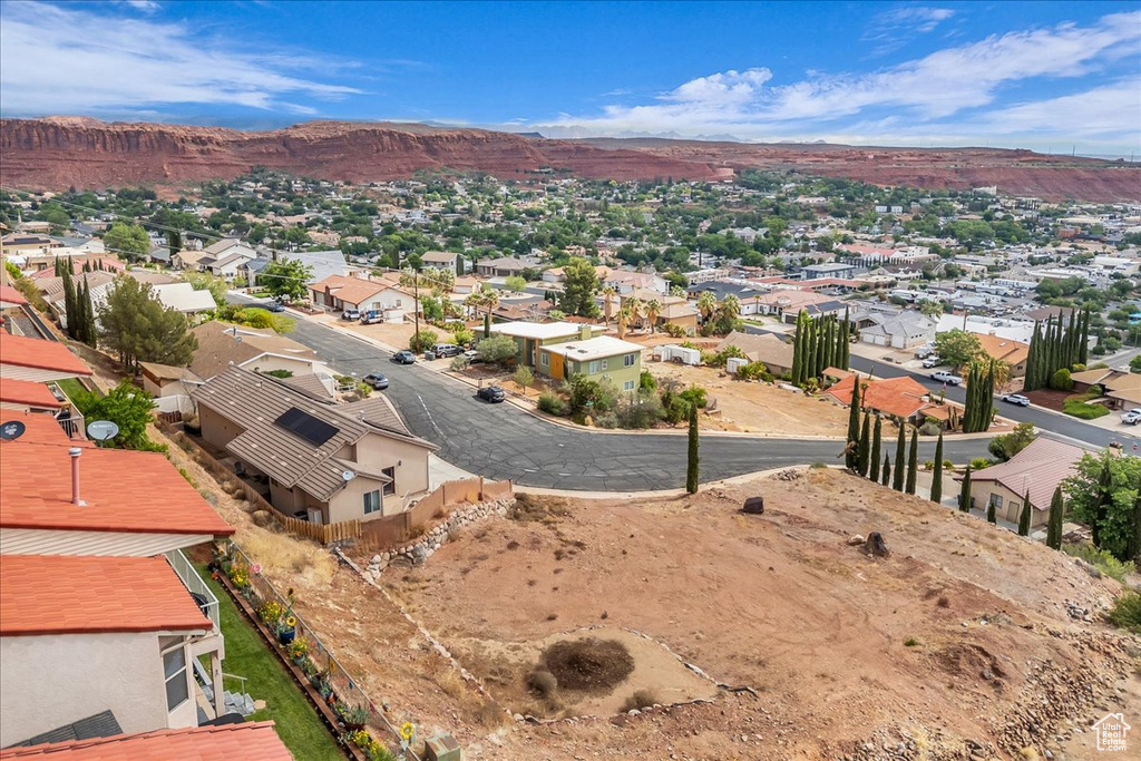 Aerial view of residential area featuring a mountain backdrop