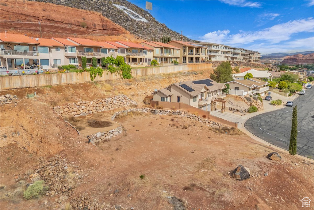 Aerial view of residential area featuring a mountain backdrop