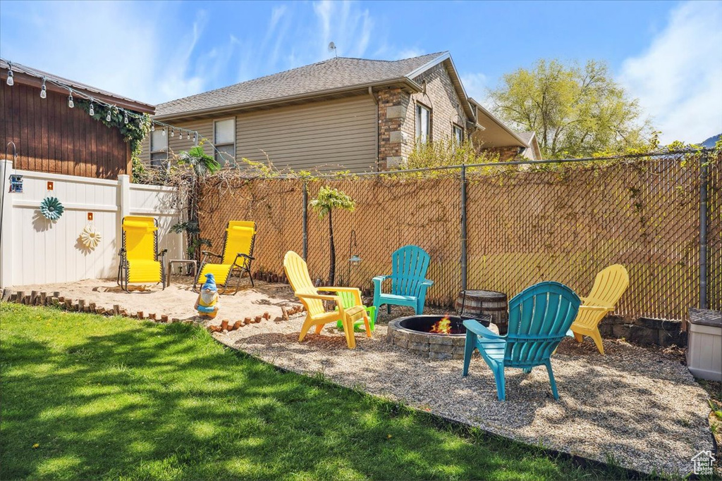 View of yard featuring a fire pit