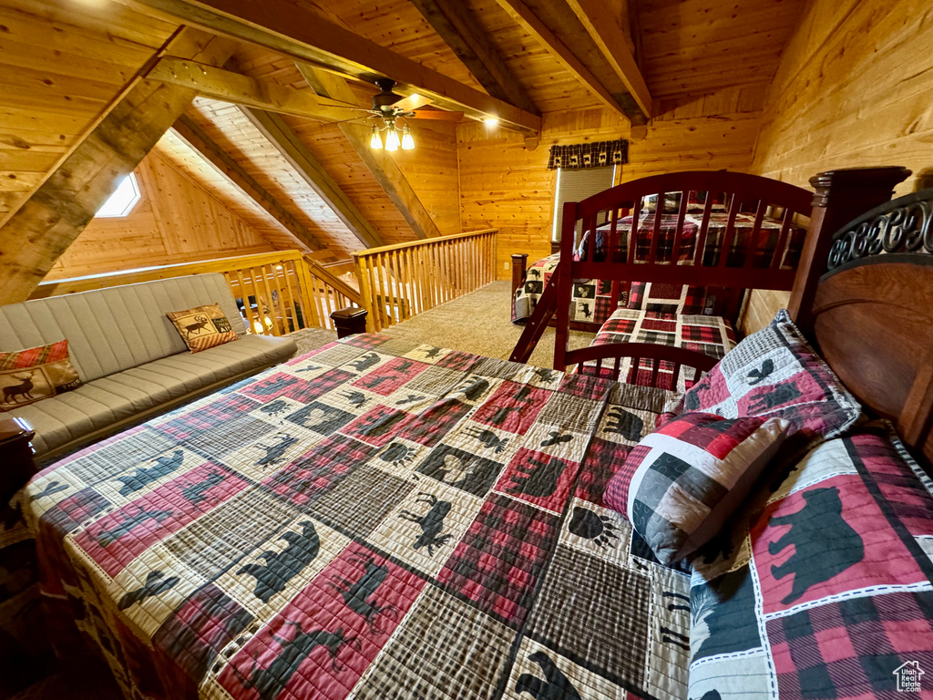 Bedroom with wooden walls and wood ceiling