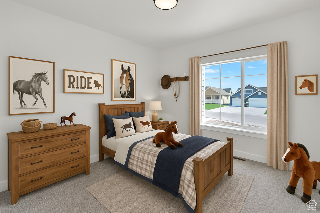 Bedroom with light carpet and baseboards