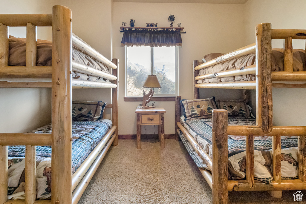 Carpeted bedroom with baseboards