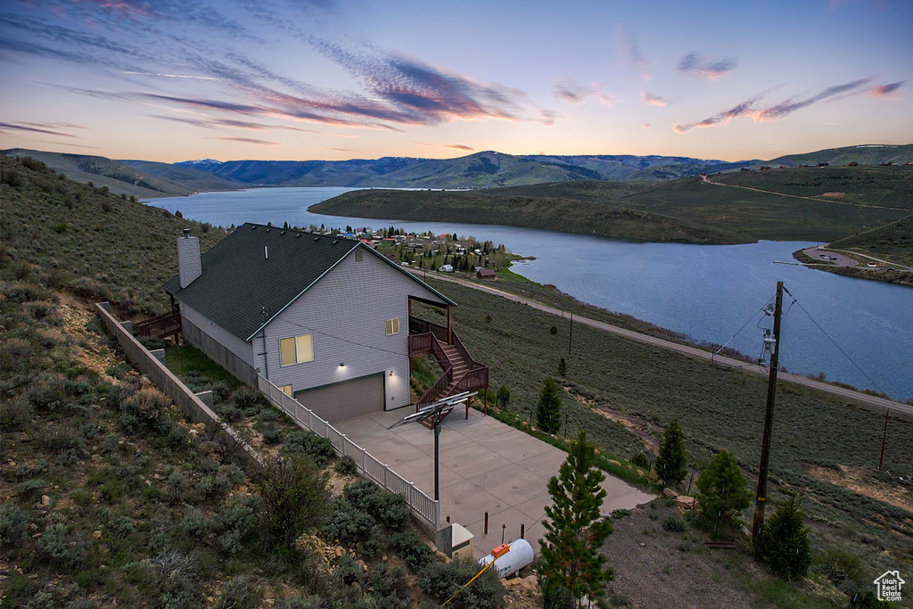 Aerial view at dusk of a water and mountain view