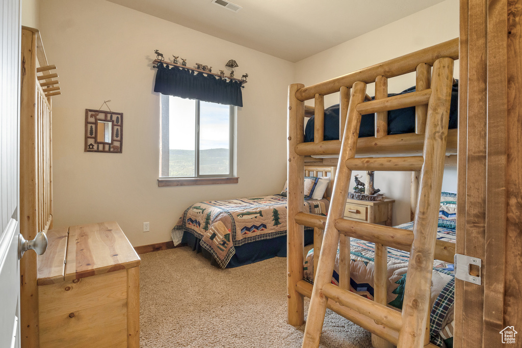 Carpeted bedroom with baseboards