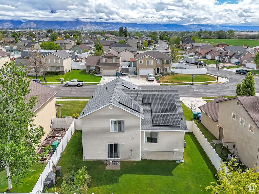 Aerial view of residential area with a mountainous background