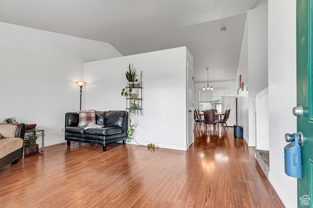Sitting room with wood finished floors and baseboards