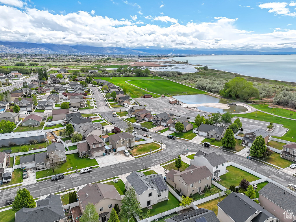 Aerial perspective of suburban area with a large body of water