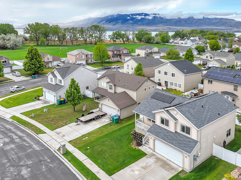 Aerial perspective of suburban area featuring a mountainous background